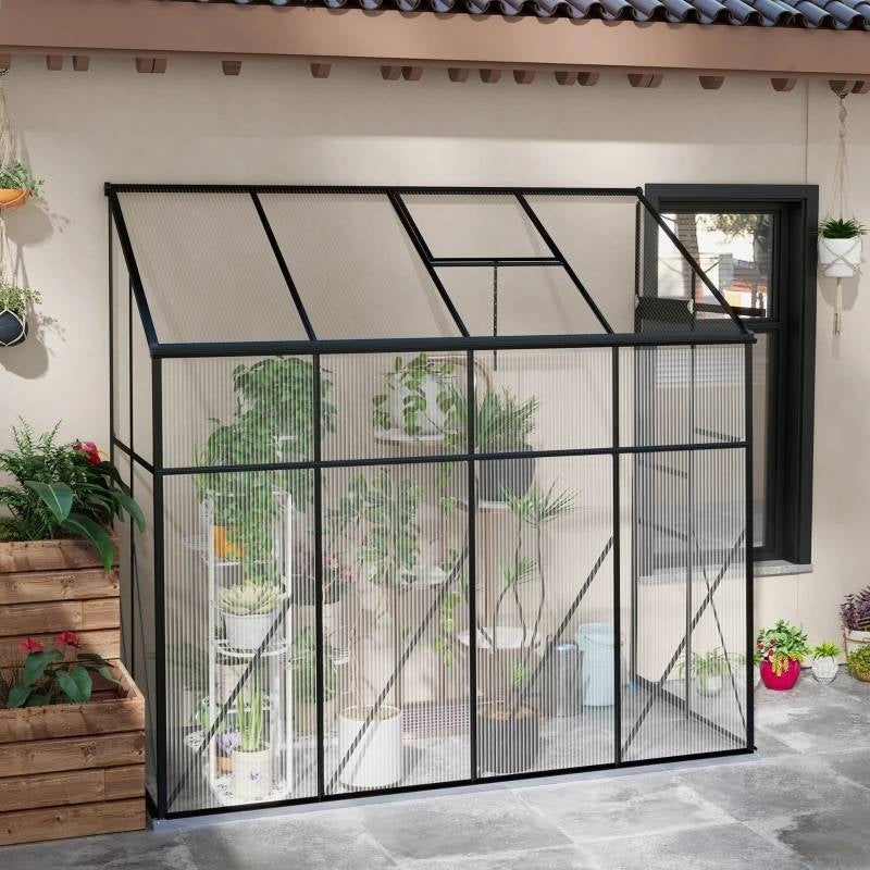 Polycarbonate lean-to greenhouse with black metal frame