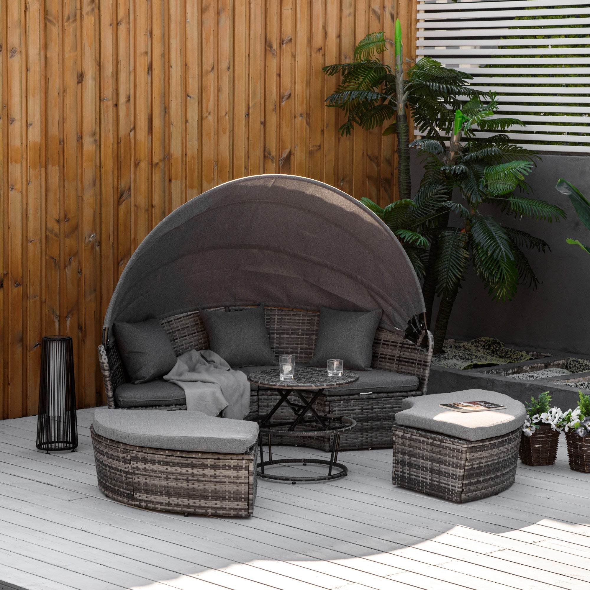 Round rattan daybed with adjustable sun canopy